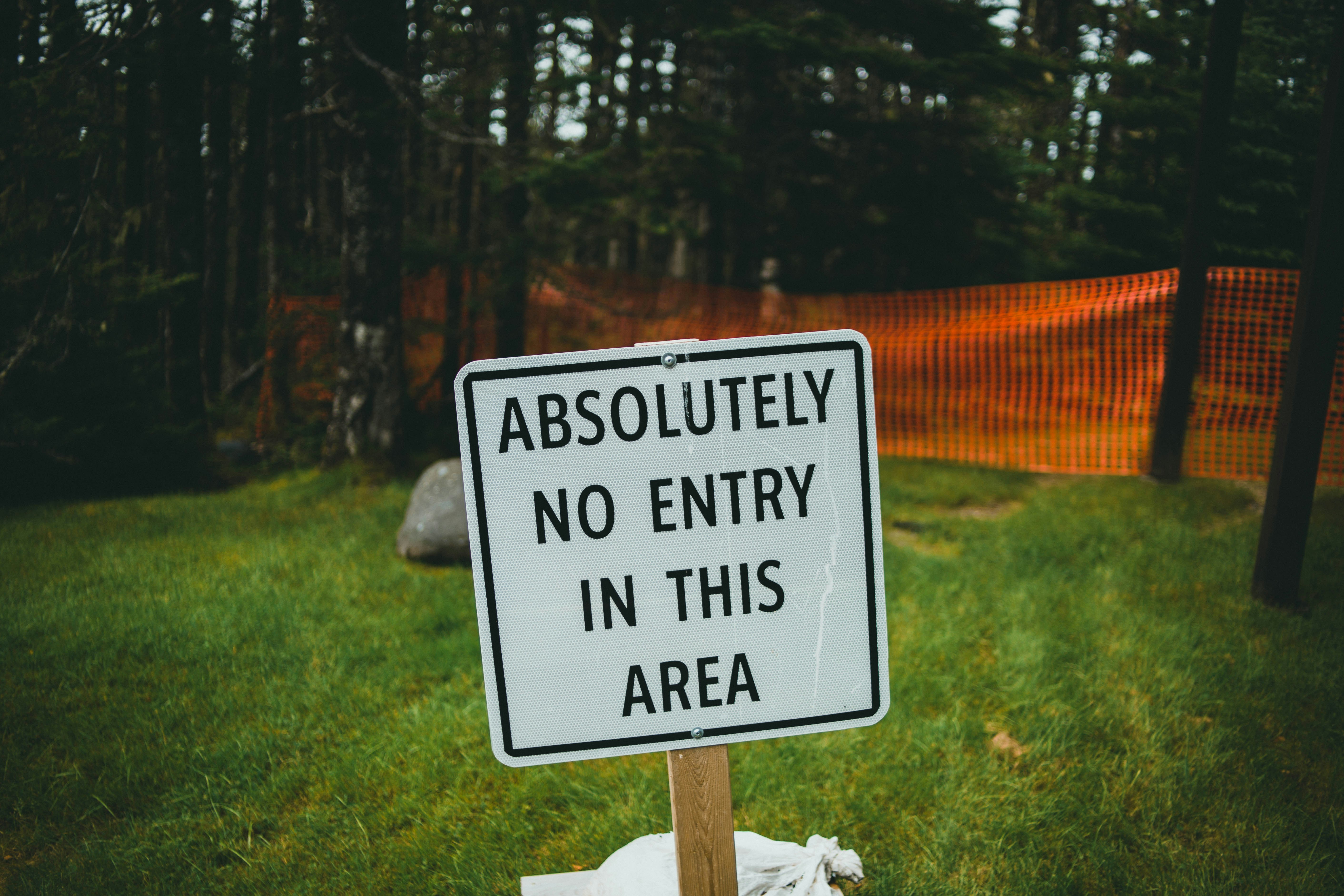 white and black wooden signage